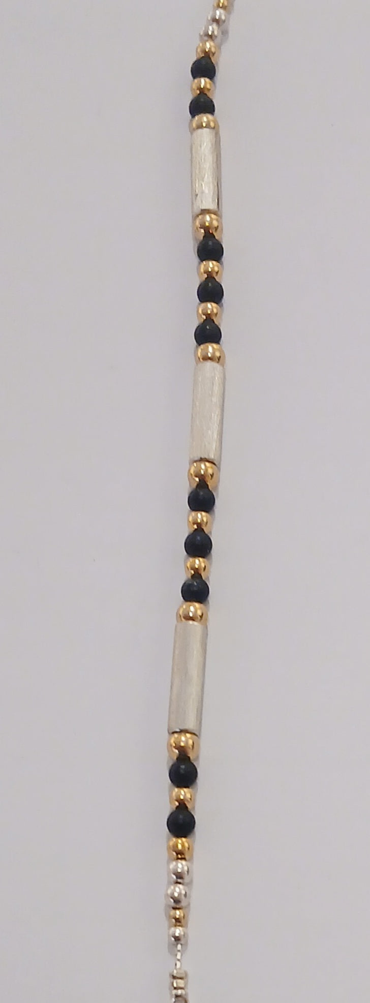 Silver, Gold and Onyx Bracelet