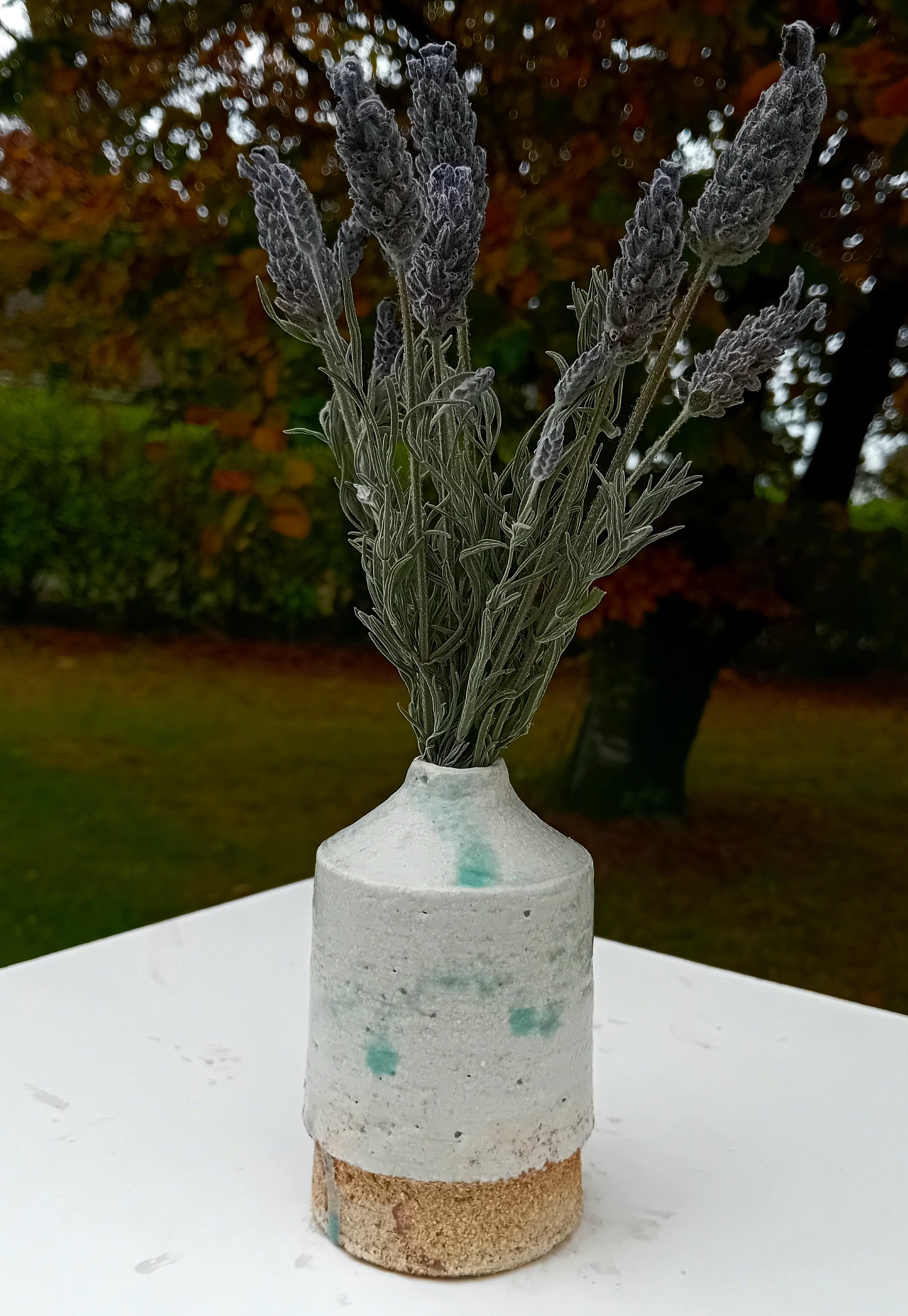 Small green ceramic vase.