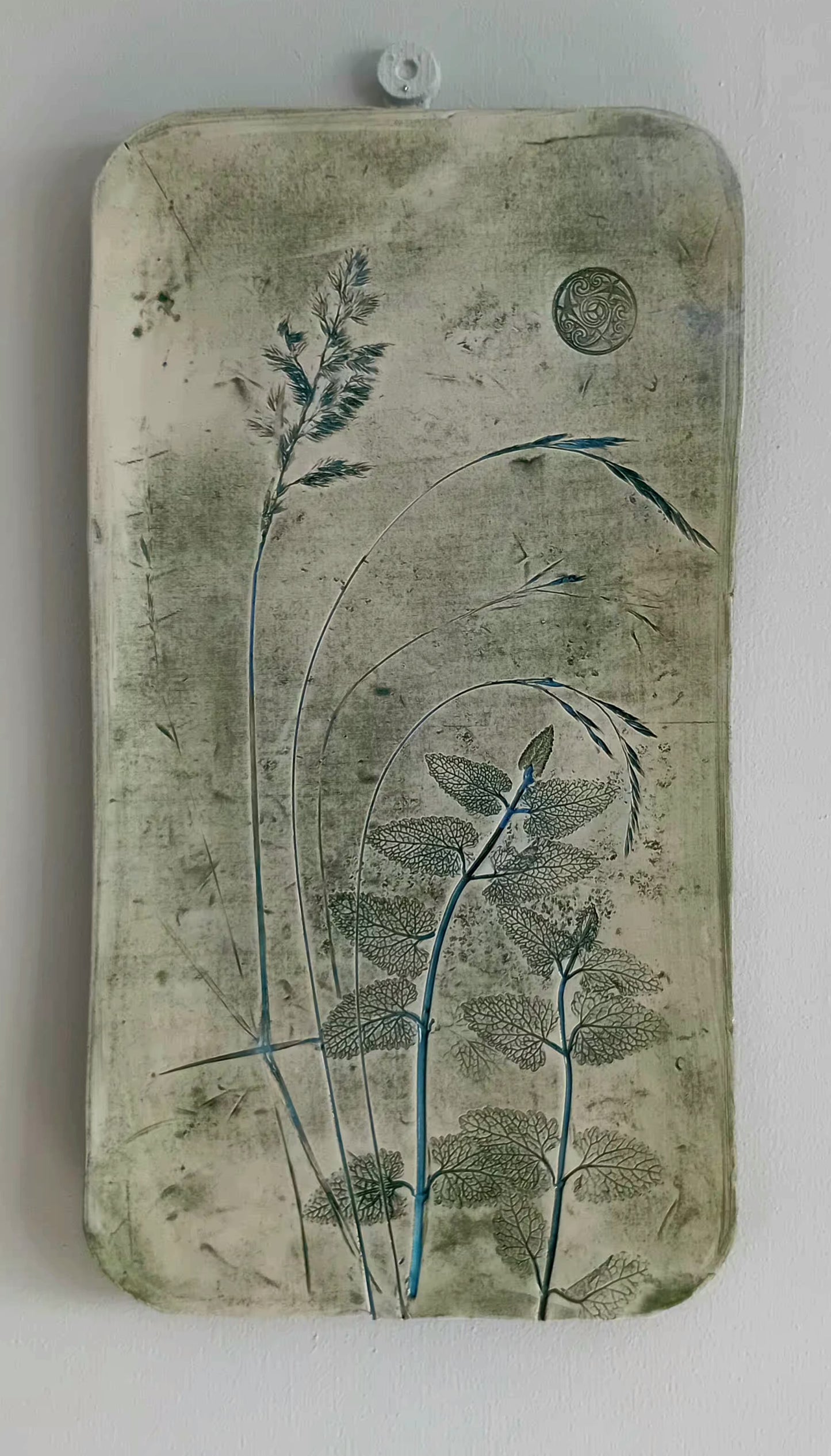 Small Ceramic wall piece with florial design