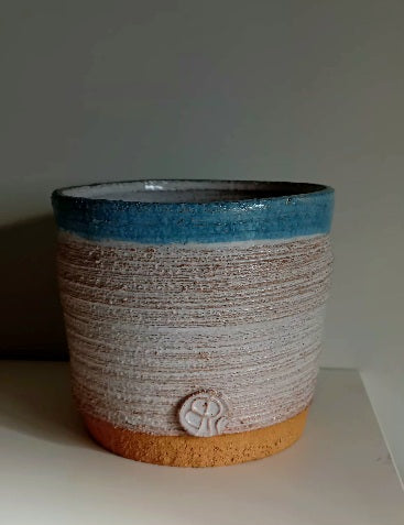 Ceramic vase with white tin glase and blue rim