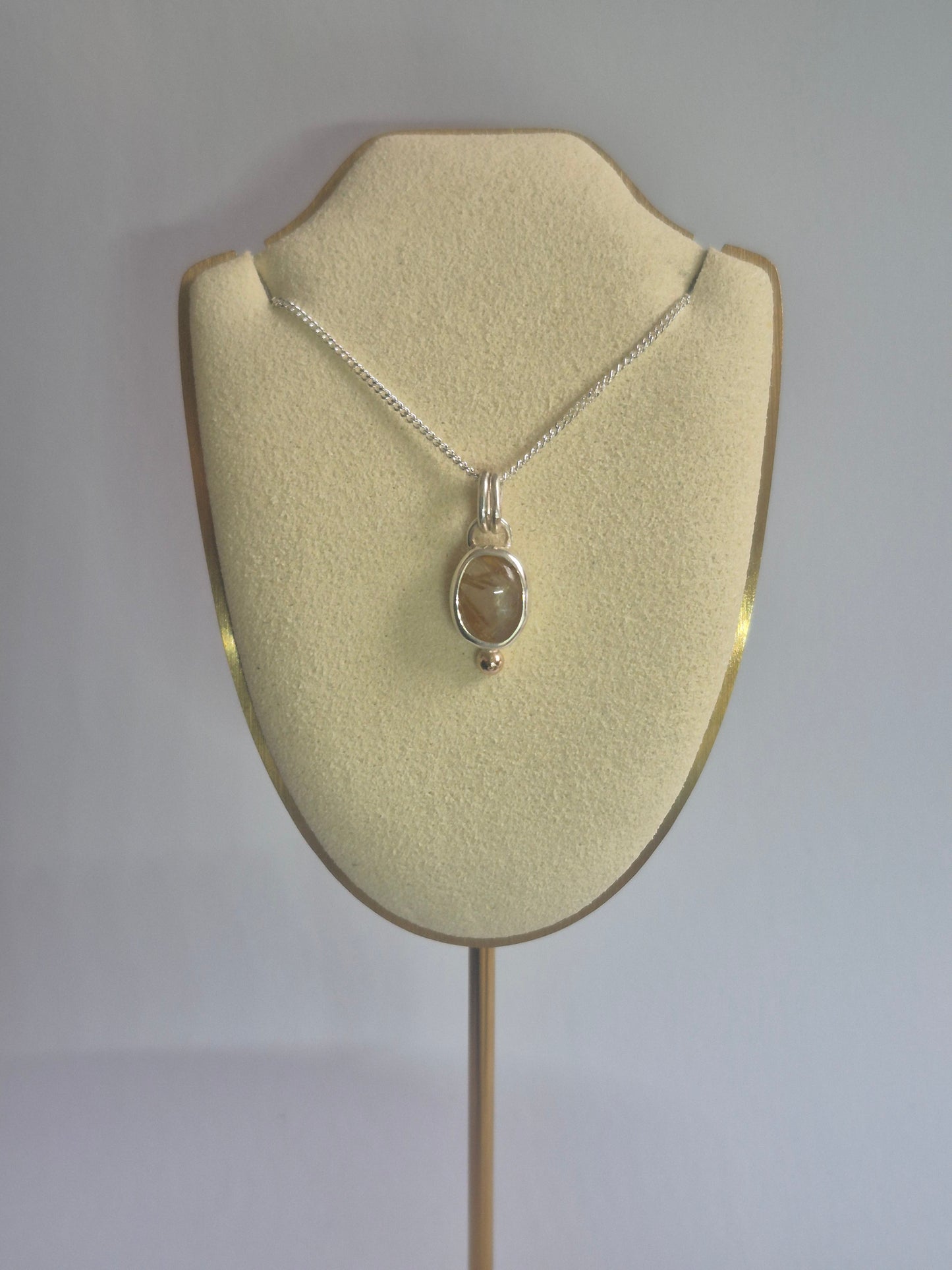 Rutilated quartz pendant in silver and 9k gold