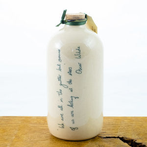 Message on a bottle. We are all in the gutter, but some of us are looking at the stars - Oscar Wilde.