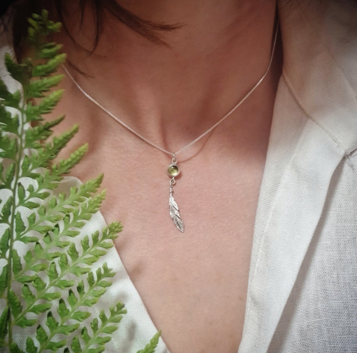 Peridot feather pendant