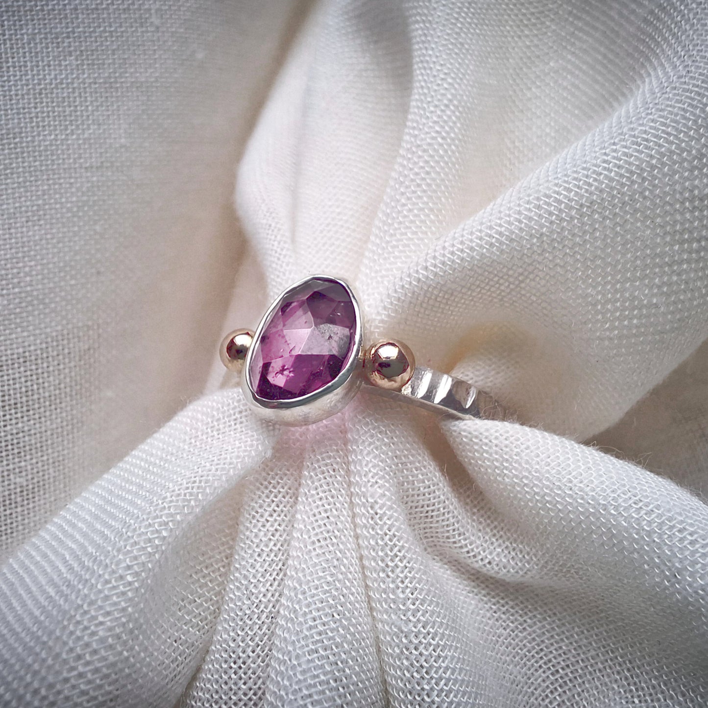 Garnet, silver and 14k gold ring