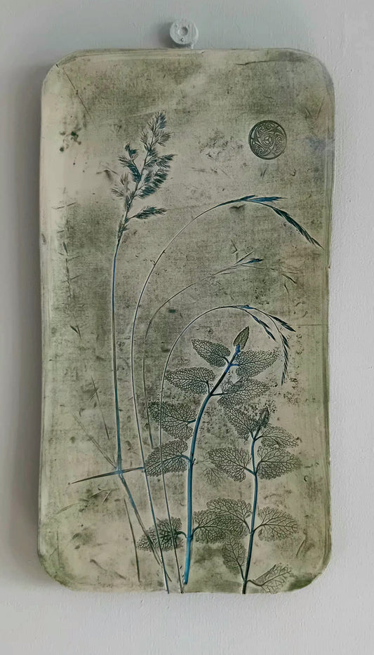 Small Ceramic wall piece with florial design