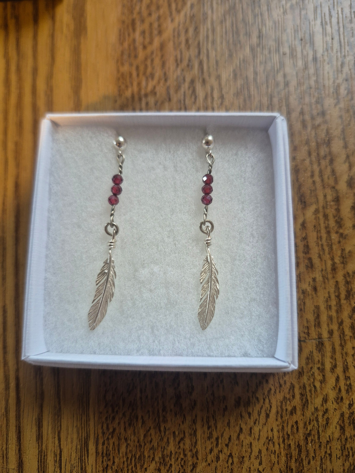 Garnet feather earrings