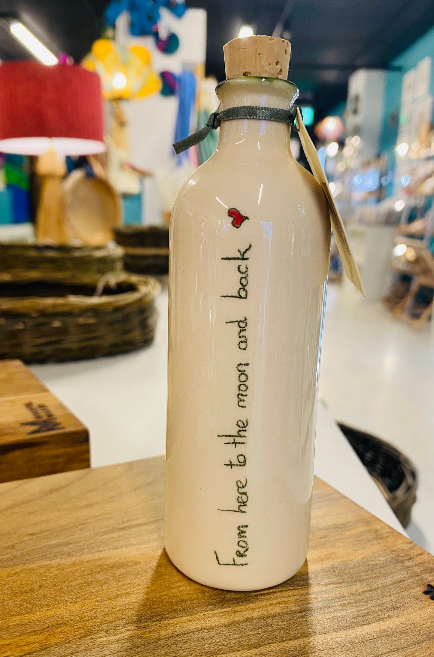 Message on a bottle  ‘From here to the moon and back’ .