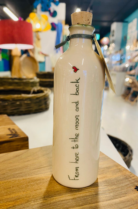 Message on a bottle  ‘From here to the moon and back’ .