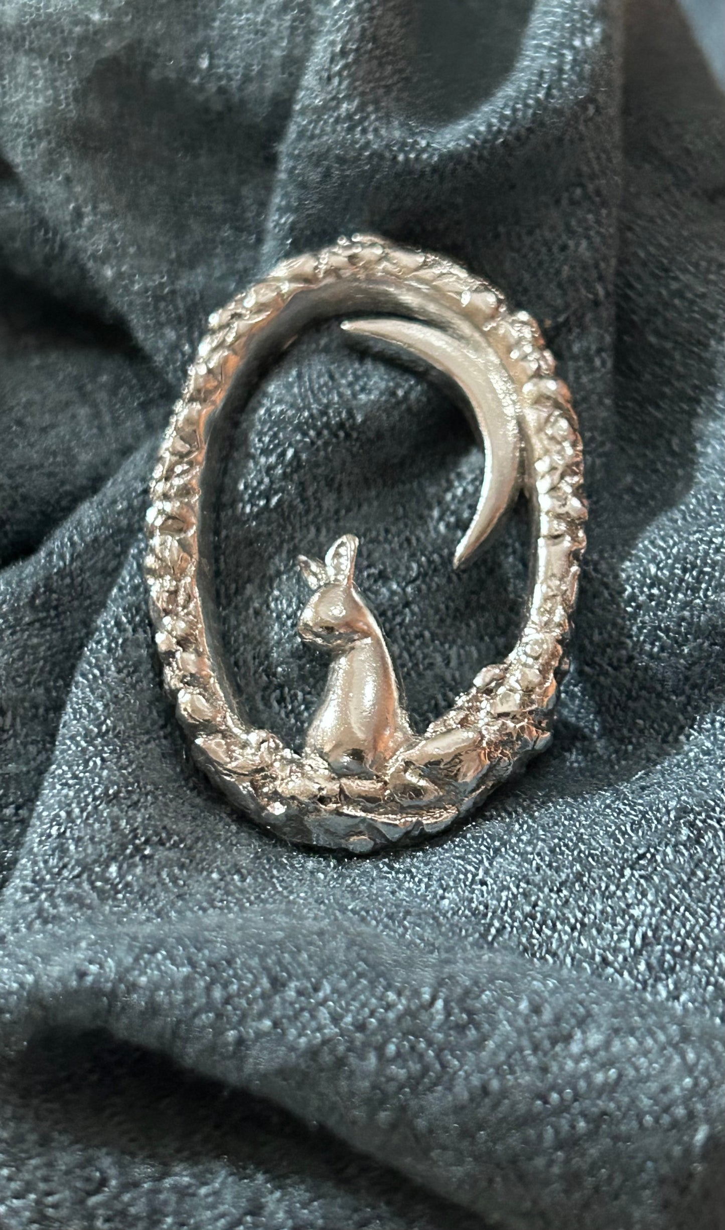 Hare under a crescent moon brooch