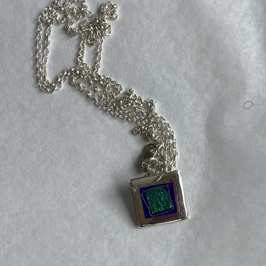 Silver square pendant with enamel centre