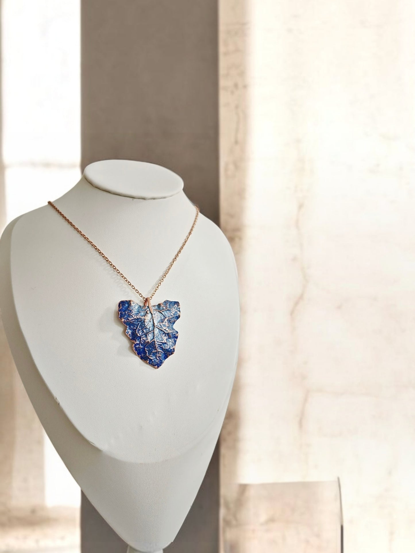 129 Coltsfoot Leaf Pendant — Blue Patina