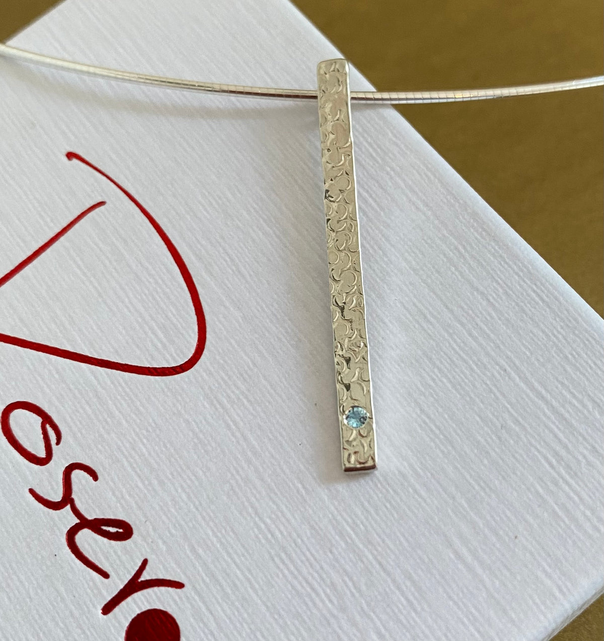 A Precious Topaz Stem Pendant.