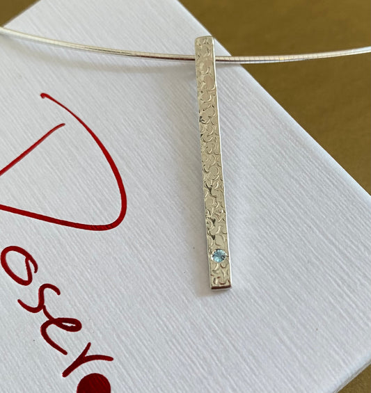 A Precious Topaz Stem Pendant.