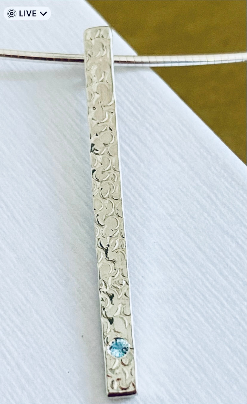 A Precious Topaz Stem Pendant.