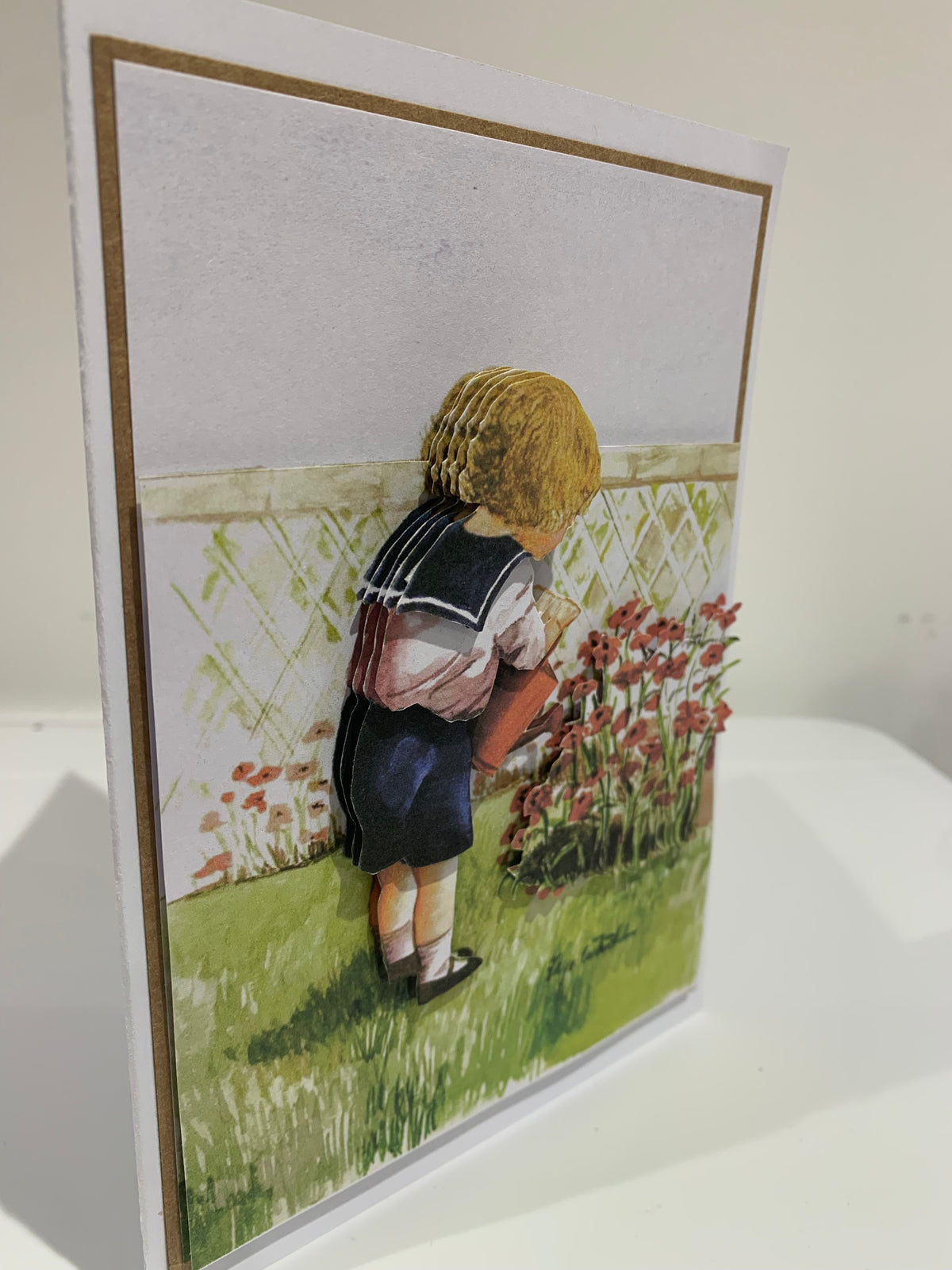 Boy watering flowers vintage card