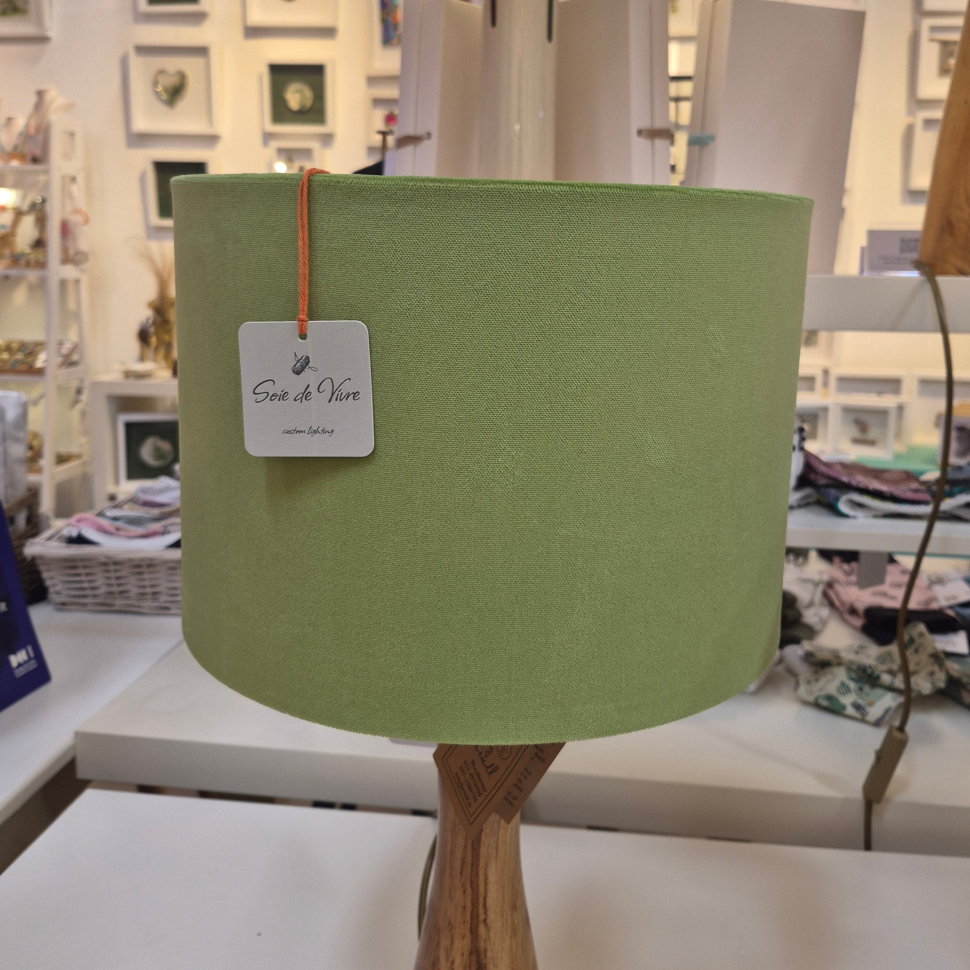 A side profile of the green velvet drum shade.