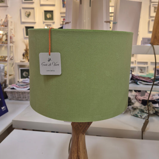 A side profile of the green velvet drum shade.