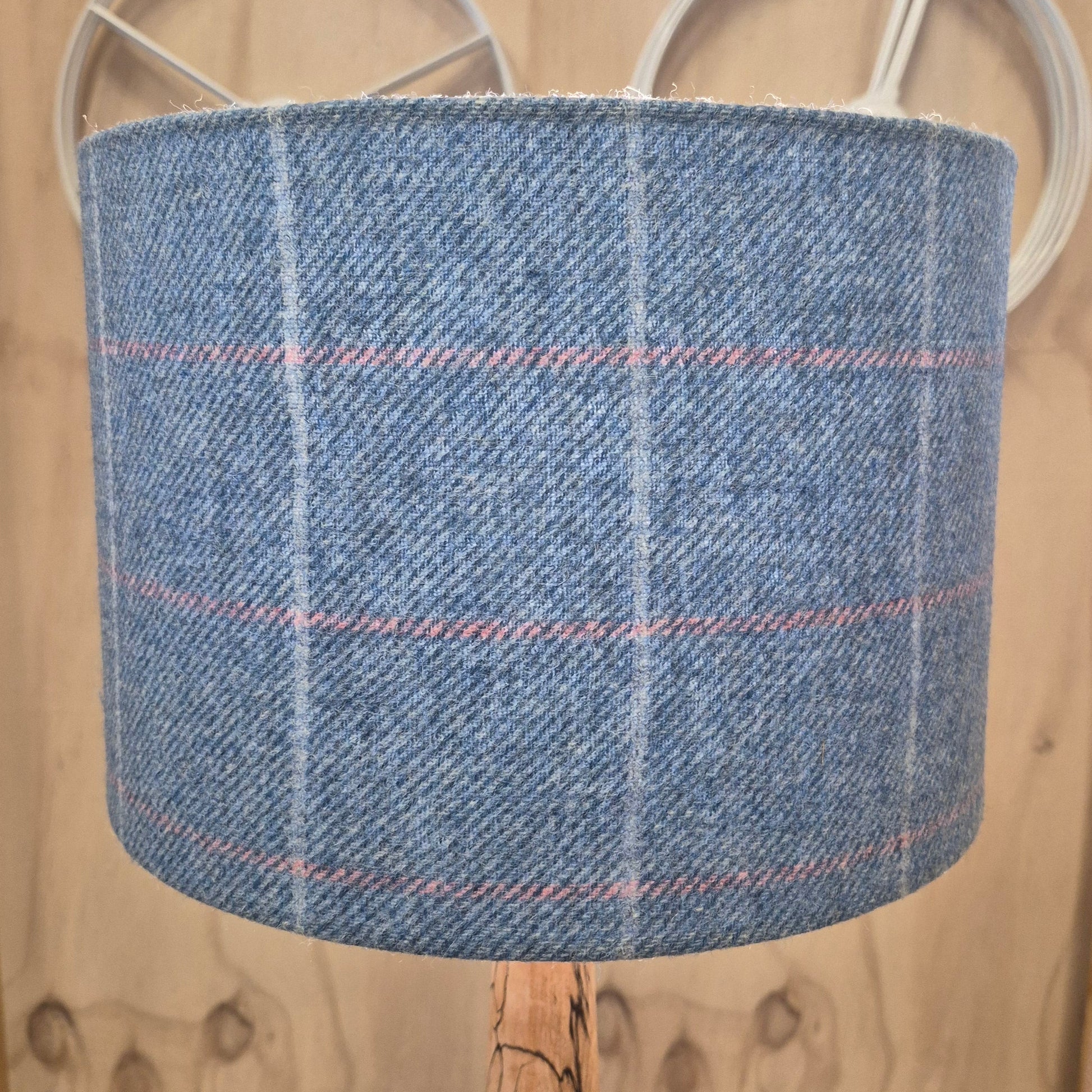 A 100% wool Yorkshire tweed 30cm drum shade in tones of blue grey and pink.